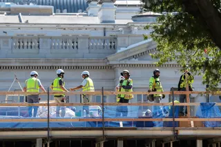 Construction workers stand at the site of the planned White House ballroom on Wednesday. Photo: Reuters