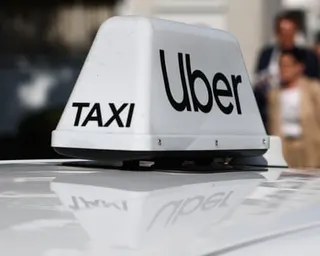 An Uber sign on a taxi