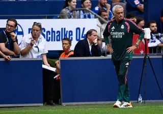 Real Madrid coach Jose Mourinho (standing, right) is confident the club’s star footballers can gel. — AFP pic
