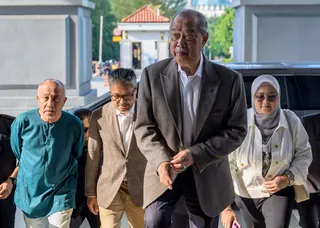 Tan Sri Muhyiddin Yassin arrives at the Kuala Lumpur Courts Complex ahead of the trial. - BERNAMA PIC