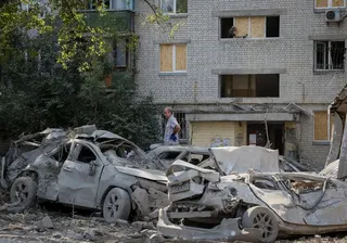 A man at the site of a missile strike in Kyiv on Thursday, amid Russia’s attack on Ukraine. Photo: Reuters