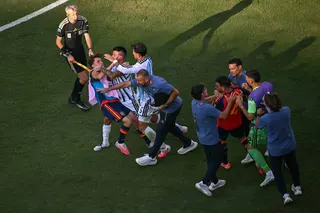 Players from Spain and Argentina are involved in a scuffle after the World Cup final. Photo: TNS