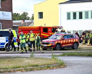 Police and emergency personnel outside the Brinell school in Fagersta, Sweden, after a 17-year-old girl was killed and several people were injured in a sword attack.
