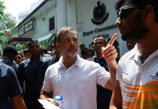 Indian opposition leader Rahul Gandhi gestures as he speaks with the media at a police station in New Delhi, August 21, 2026
