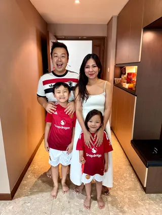 Justin Ko with his wife and children. Under the new measures, Ko and his wife will each get 10 days of leave.