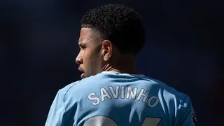 The back of Savino's shirt with his head turned to the side