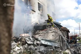 A firefighter works at the site of a residential building hit by a Russian drone strike, amid Russia’s attack on Ukraine, in Chernihiv, Ukraine on Monday. Photo: Press service of the State Emergency Service of Ukraine in Chernihiv region/Handout via Reuters