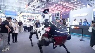A humanoid robot riding a mechanical horse in front of onlookers