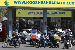 Drivers queue at a petrol station to refuel in Tehran, Iran, on Tuesday. Photo: AFP