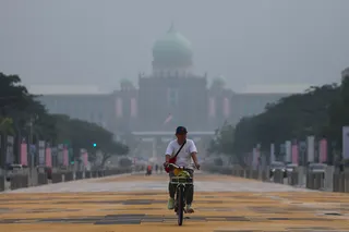 Malaysian government buildings are seen shrouded in haze in Putrajaya on Tuesday. Photo: EPA
