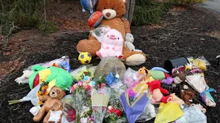 A makeshift memorial outside  the home of Lindsay Clancy
