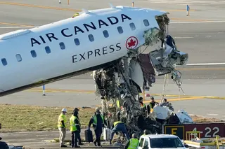 Officials and aircraft maintenance workers pick through debris and remove luggage as they inspect the wreckage of an Air Canada Express jet at LaGuardia Airport in March. Photo: AP