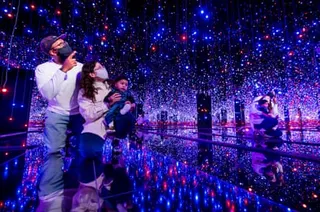Visitors inside Yayoi Kusama’s show at the Tate Modern, London in 2021.