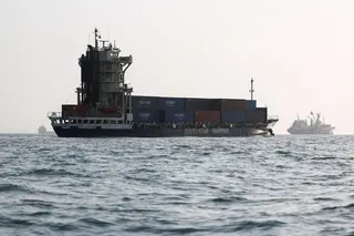Vessels in the Strait of Hormuz are visible near the beach of Bandar Abbas, Iran, on Aug 27. The blockaded strait carries roughly a fifth of the world’s energy supplies.