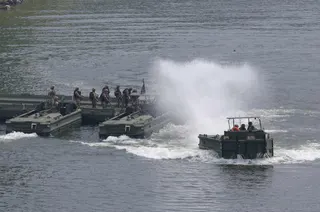 US soldiers set up a floating bridge during joint US-South Korean military exercises in Yeoncheon, South Korea on August 20. Photo: Yonhap/AFP