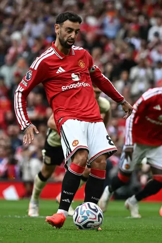 Manchester United's Portuguese midfielder #08 Bruno Fernandes takes a penalty kick to score the team's third goal during the English Premier League football match between Manchester United and Ipswich Town at Old Trafford in Manchester, north west England, on August 30, 2026. (Photo by Paul ELLIS / AFP) / RESTRICTED TO EDITORIAL USE. No use with unauthorized audio, video, data, fixture lists, club/league logos or 'live' services. Online in-match use limited to 120 images. An additional 40 images