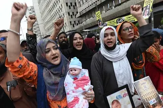 Human rights activists hold a candlelight vigil to mourn the deaths of 14 newborns killed in a hospital fire, in Karachi, Pakistan, on Friday. Photo: EPA-EFE
