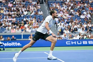 Russia's Daniil Medvedev chases a shot from France's Hugo Gaston during their men's singles first round tennis match on day one of the US Open tennis tournament at the USTA Billie Jean King National Tennis Center in New York on August 30, 2026. (Photo by ANGELA WEISS / AFP)