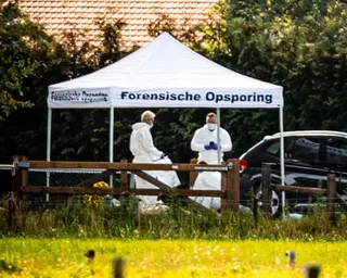 Police in forensic gear investigating in Overasselt