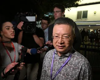 China’s special envoy for Pacific Island affairs, Qian Bo, leaves the opening ceremony at the Pacific Islands Forum leaders’ meeting in Koror, Palau, on Monday