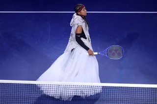 Naomi Osaka walks onto the court to face Anastasia Zakharova in their first-round match on day two of the US Open at USTA Billie Jean King National Tennis Center on Monday. Photo: AFP