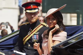Britain’s Prince Harry, Duke of Sussex and Meghan, Duchess of Sussex, ride in a horse-drawn carriage in London in June 2018. Photo: AFP