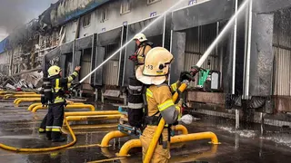 Firefighters work at a site of a Russian drone attack, amid Russia's attack on Ukraine, in the Kyiv region, Ukraine, in this handout picture released August 18, 2026.