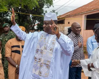 Gen Horta Inta-A Na Man holds up his hands at a polling station