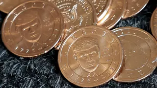 US President Donald Trump's portrait on $1 coins, in honor of the nation's 250th anniversary of independence, on the day the coin is released for sale.