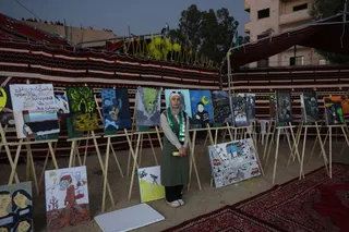 MOADAMIYAT AL-SHAM, SYRIA - AUGUST 21: A drawing exhibition by a group of young men and women depicting various scenes related to the chemical attack, during an event commemorating the attack on August 21, 2025 in Moadamiyat Al-Sham, Syria. On 21 August 2013 President Bashar al-Assad ordered strikes on two opposition-controlled areas of Ghouta, in the suburbs around Damascus. The rockets contained the chemical nerve agent Sarin which went on to kill up to 1700 people. The attack was the deadlies