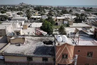 The impacted building and surrounding area. Photo: Tasnim News Agency via AP