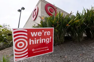 FILE PHOTO: A sign posted outside a Target store states the company is hiring in Encinitas, California, U.S., March 30, 2026. REUTERS/Mike Blake/File Photo