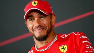 Ferrari's Lewis Hamilton smiles during an official news conference before the Italian Grand Prix