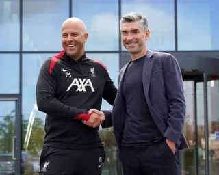 Richard Hughes shakes hands with Arne Slot outside Liverpool's training centre in July 2024