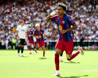 Lamine Yamal cups his ear to the crowd after giving Barcelona the lead after only six minutes.