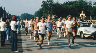 Drivers and team members take part in a track run at the 1973 Italian Grand Prix