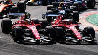 Lewis Hamilton and Charles Leclerc go wheel-to-wheel at the first chicane at Monza